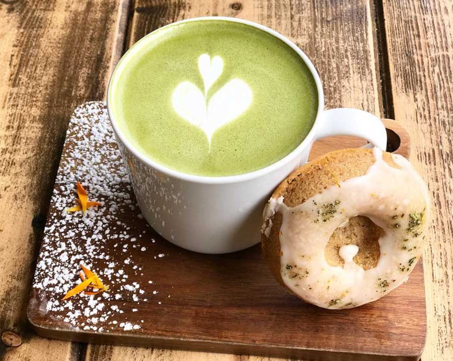 matcha drink with a donut